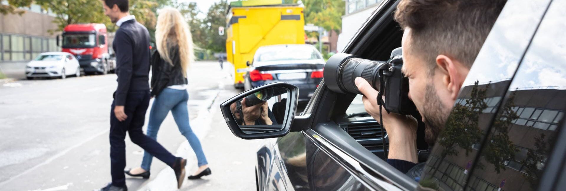 Private Detective Taking Photos Of Man And Woman From a Car - Depositphotos_311513588_XL (1)