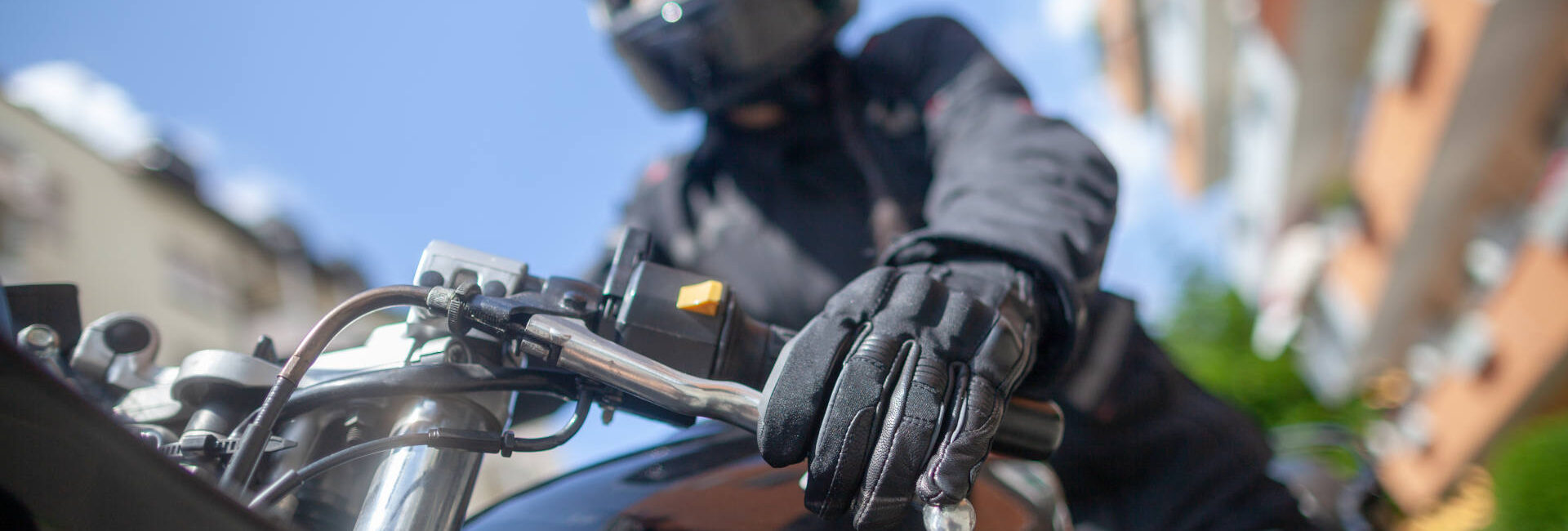 Woman with a black helmet on a motorbike